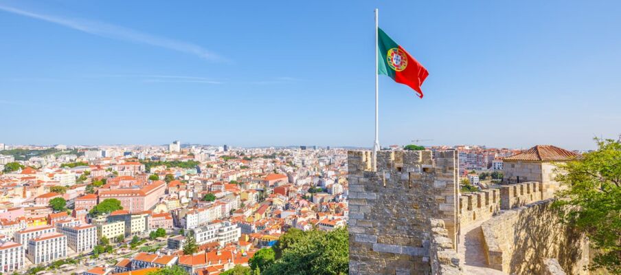 Flag of Portugal with capital The flag of Portugal with the capital in the background